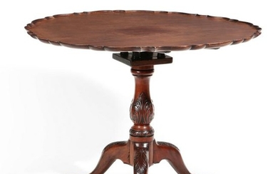 A George III carved mahogany tilt top table