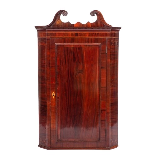 A George III mahogany and inlaid hanging corner cupboard:, b...