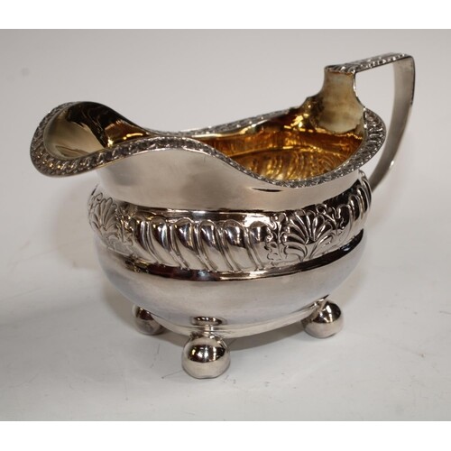 A George III silver cream jug, acanthus capped angular handl...