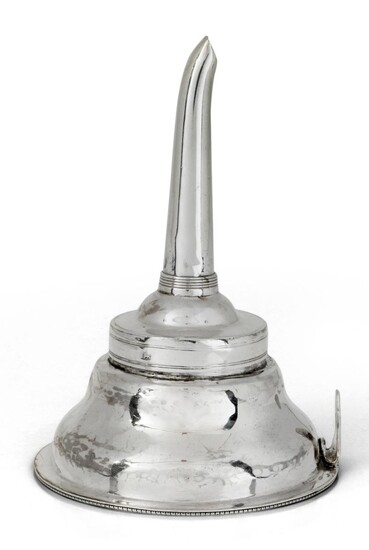 A George III silver wine funnel, London, 1791, maker probably A.F., the straining section with side clip and beaded rim, the detachable reeded funnel possibly associated, marks rubbed (lion passant only), 12.7cm long, approx. weight 2.6oz