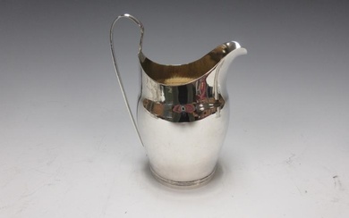 A Georgian silver Cream Jug engraved initial, reeded handle,...