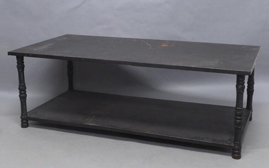 A Gothic style two tier coffee table, 20th century, with sheet metal tiers, raised on cast iron frame and legs, 46cm high, 135cm wide, 68cm deep Provenance: Property of Future PLC, removed from the offices of Country Life magazine.