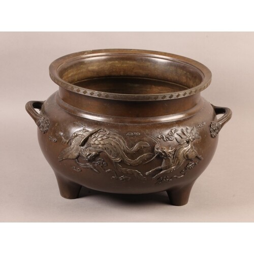 A JAPANESE BRONZE TWO HANDLED LARGE CENSER, cast in relief w...