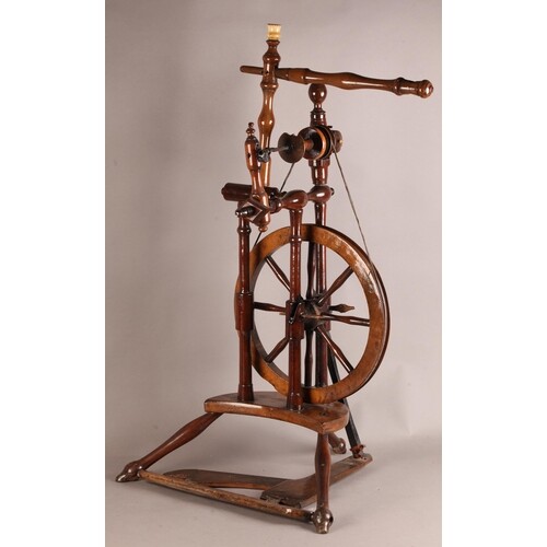 A LATE 18TH/EARLY 19TH CENTURY FRUITWOOD SPINNING WHEEL of c...