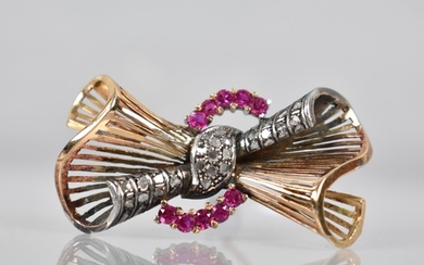 A Large Diamond and Ruby Bow Brooch in Gold and White Metal,...