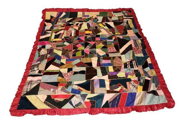 A Late 19th Century Crazy Patchwork Bed Cover, incorporating coloured...
