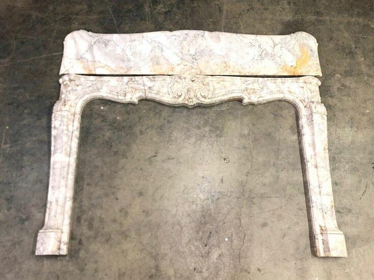 A Louis XV style marble fire surround