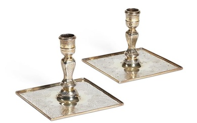 A MATCHED PAIR OF GEORGE II SILVER-GILT CANDLESTICKS