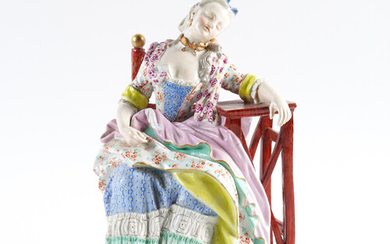 A MEISSEN FIGURE OF A SEATED WOMAN