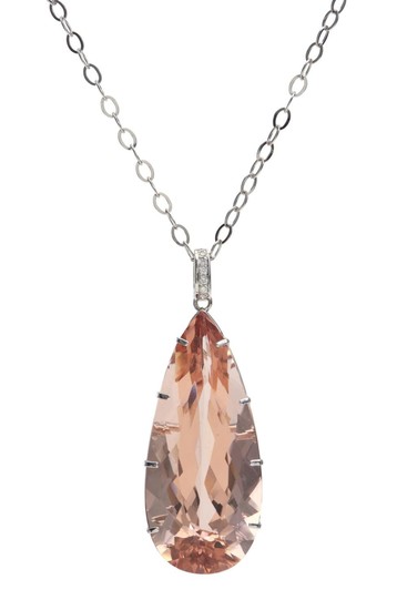 A MORGANITE AND DIAMOND PENDANT - The pear cut morganite weighing 117.37cts, to a diamond set bale, suspended from a fine link chain...