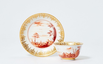 A Meissen tea bowl and saucer with merchant navy scenes in iron red