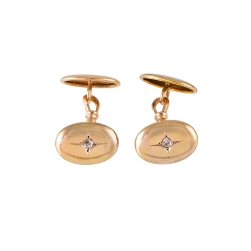 A PAIR OF ANTIQUE GOLD CUFFLINKS, the oval panels set with r...