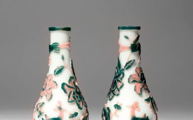 A PAIR OF CHINESE BEIJING PINK AND GREEN-OVERLAY GLASS 'PHOENIX'...