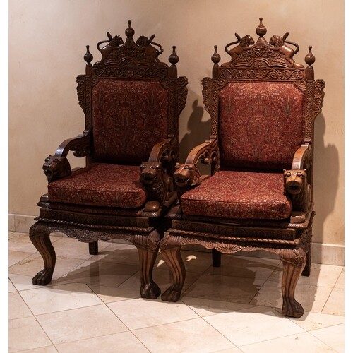 A PAIR OF INDIAN THRONE ARMCHAIRS Each padded back surmounte...