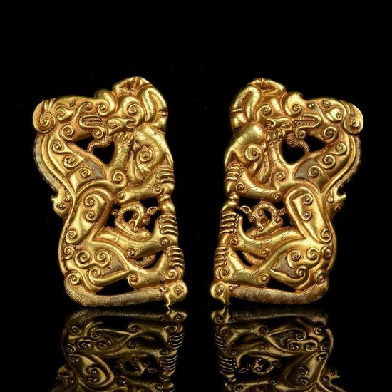 A PAIR OF PURE GOLD MYTHICAL BEAST PLAQUES