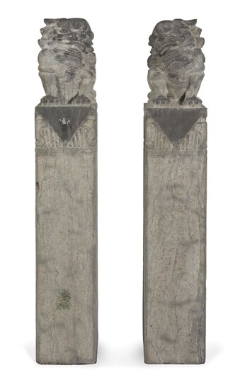 A PAIR OF SCHISTO COLUMNS WITH BUDDHIST LIONS. 20TH CENTURY.