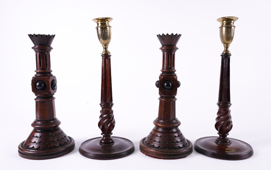 A PAIR OF VICTORIAN GOTHIC REVIVAL OAK CANDLESTICKS (4)