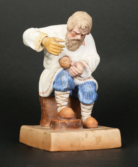 A GARDNER RUSSIAN BISCUIT PORCELAIN FIGURE OF A TAILOR