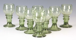 A SET OF EIGHT 19TH CENTURY CONTINENTAL PALE GREEN WINE GLAS...