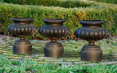A SET OF THREE FRENCH BLACK PAINTED CAST IRON VASES, LATE 19TH CENTURY, BY FONDERIE CORNEAU ALFRED