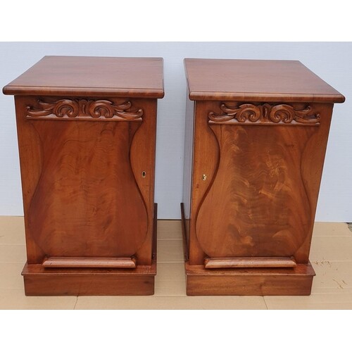 A SOLID PAIR OF LATE 19TH CENTURY MAHOGANY BEDSIDE CABINETS,...