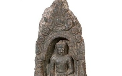 A Southeast Asian stone relief of seated Buddha