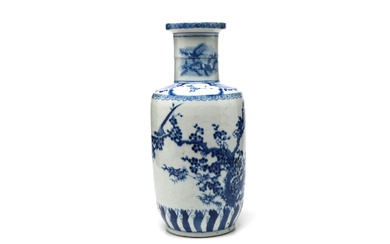 A blue and white porcelain rouleau vase painted with birds perching on plum branches