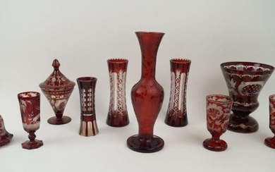 A collection of Bohemian ruby flash glassware, 20th century, to include; a vase of baluster form with elongated neck, engraved with stags in forest scene, 30.3cm high, a pair of vases, 21cm high ea., a pair of footed goblets, 14cm high, a scent...