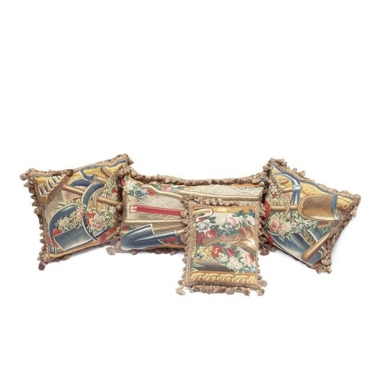 A collection of four cushions of tapestry Early 18th century, adapted from the border of a Teni...