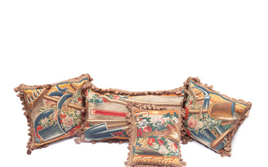 A collection of four cushions of tapestry Early 18th century,...