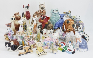 A collection of pottery cats, in a variety of colourful glazes, to include; a Rye pottery cat, of traditional form wearing a bow, printed pottery stamp to base, 15cm high, a small glazed cat with hand painted mark 'Helle B' to underside, and...