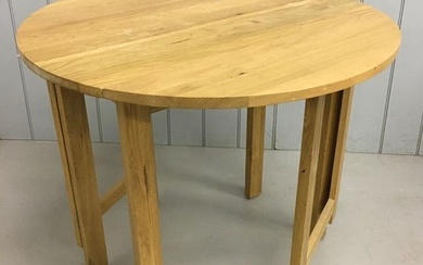 A contemporary, beech, gateleg/drop leaf kitchen table. Dime...