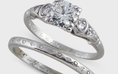 A diamond and platinum engagement ring and wedding