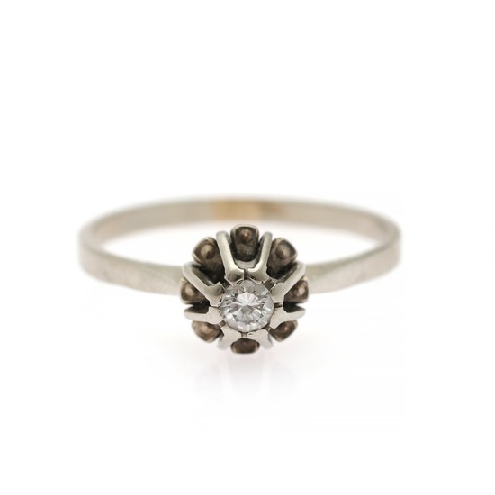 A diamond solitaire ring set with a brilliant-cut diamond weighing app. 0.13 ct., mounted in 14k white gold. Size 57.