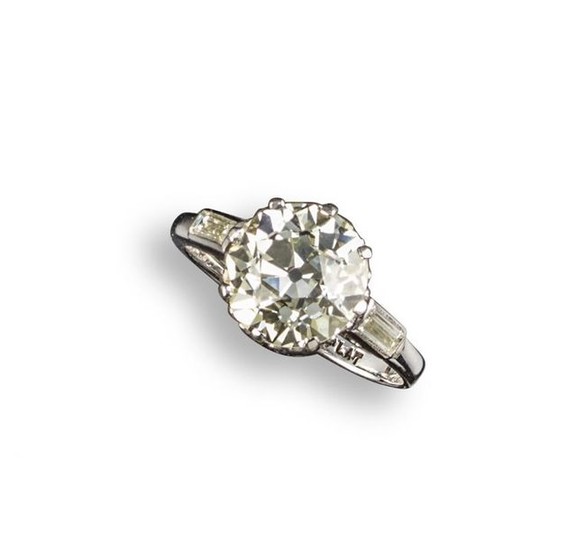 A diamond solitaire ring, the old circular-cut diamond...