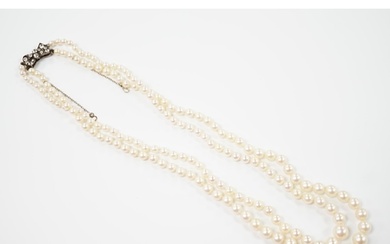 A double strand graduated cultured pearl necklace, with past...