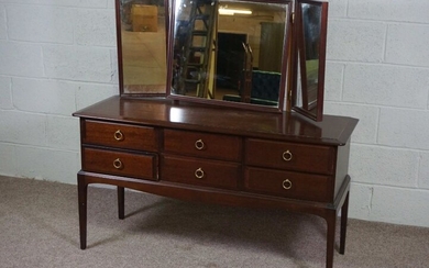 A dressing table, late 20th century, with triple mirror over six drawers, 128cm high, 130cm wide
