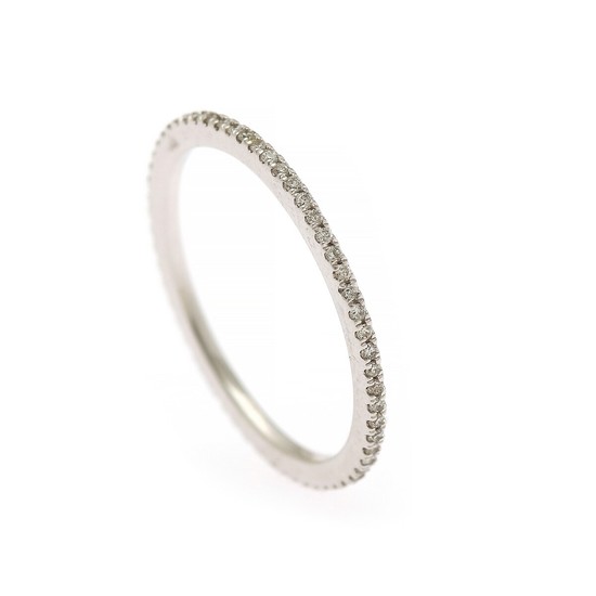 A full diamond eternity ring set with numerous brilliant-cut diamonds, mounted in 14k white gold. W. 1.2 mm. Size 56.