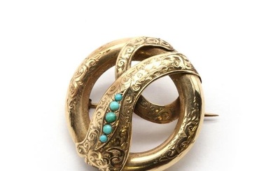 A gold and turquoise snake brooch