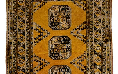 A golden Afghan rug, mid 20th century.