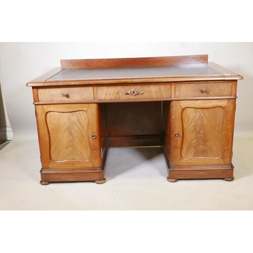 A good quality Swedish mahogany twin pedestal desk with inse...