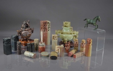 A group of Chinese soapstone and hardstone carvings