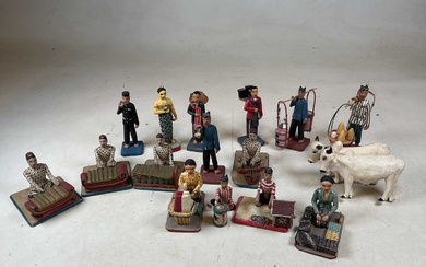 A group of mid 20th century carved wooden and painted...