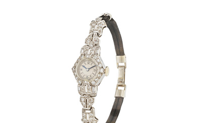 A lady's platinum manual wind wristwatch with diamond set bezel...
