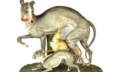 A large 19th century porcelain figure of three greyhounds, H. 27cm L. 29cm. (slightly A/F)