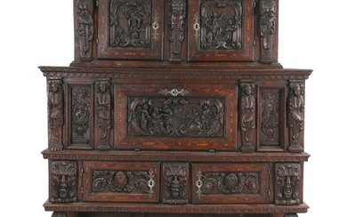A large Danish Renaissance oakwood cupboard, richly carved with biblical scenes. 1600–1650. H. 210 cm. W. 172 cm. D. 54 cm.
