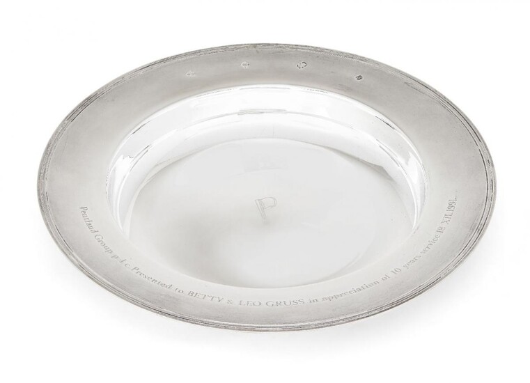 A large silver armada dish by Garrard & Co., Sheffield, c.1992, of plain circular form with reeded band and presentation engraving to rim, the base engraved with the letter 'P', 30.6cm dia., approx. weight 32.5oz