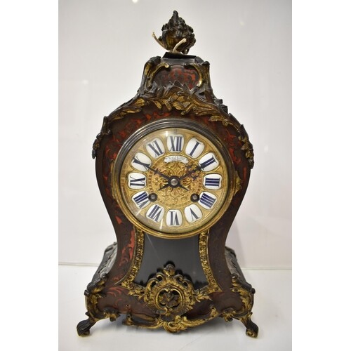 A late 19th century French Boulle mantle clock, the red tort...