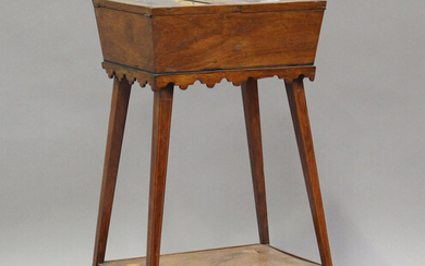 A late Victorian rosewood bijouterie table with inlaid decoration, the double hinged lid raised on t