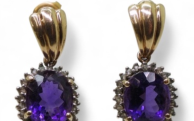 A pair of 9ct gold amethyst and clear gem set earrings, weig...